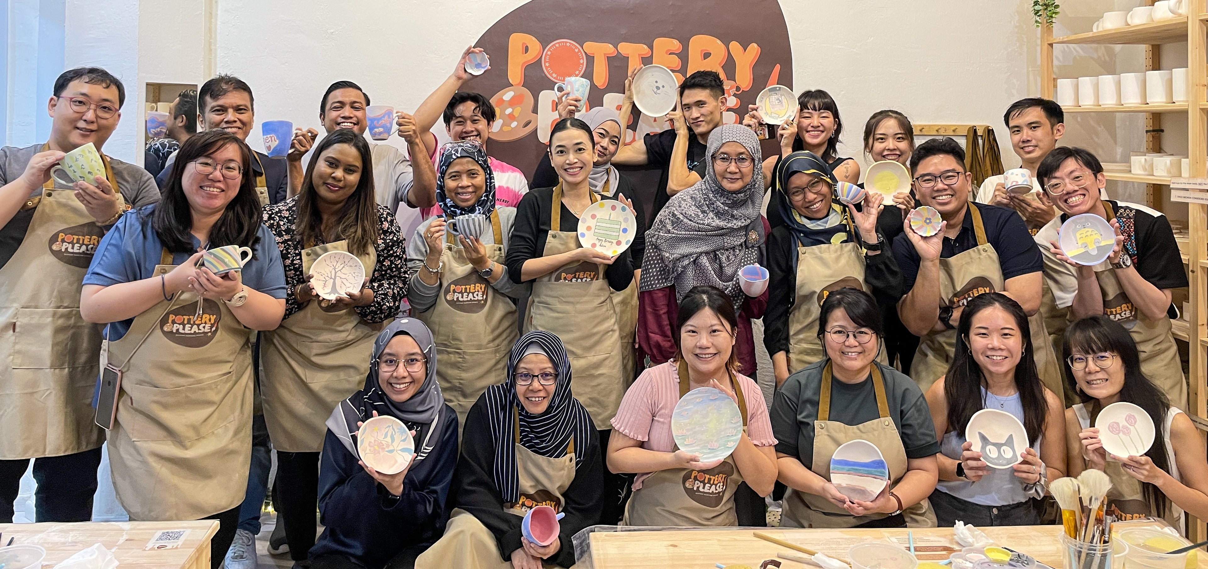 Fun and engaging corporate team-building activity with pottery painting at PotteryPlease! Singapore
