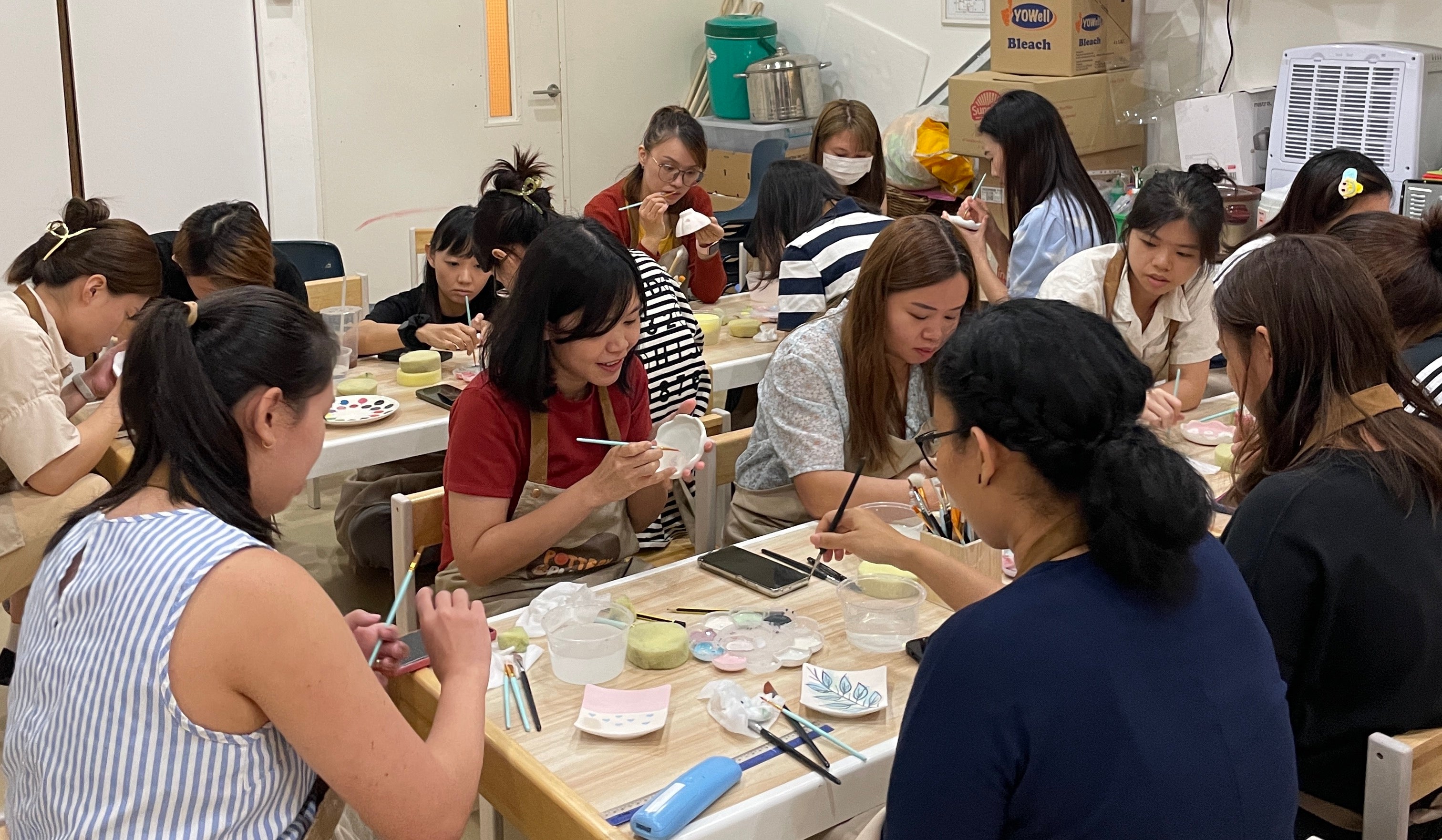 eam-building pottery painting session conducted off-site by PotteryPlease