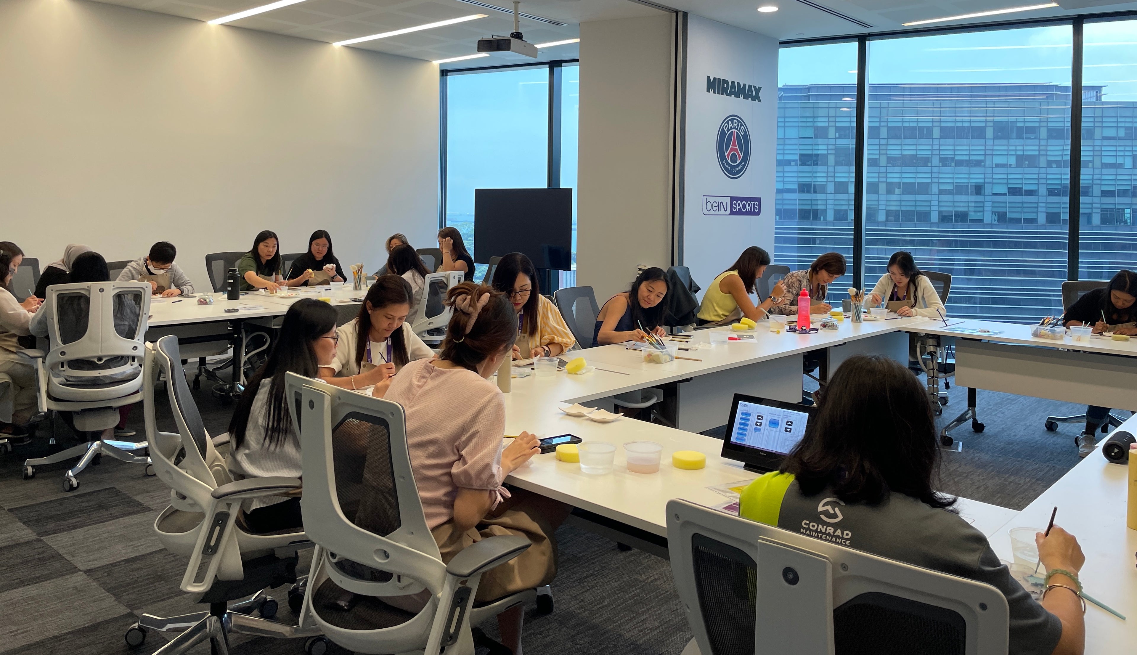 PotteryPlease hosting an off-site pottery painting event at a corporate venue in Singapore