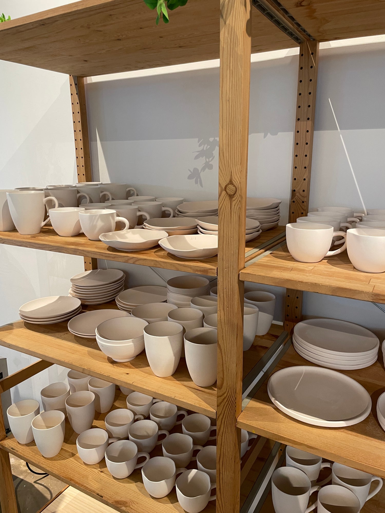 Many ceramic pottery pieces ranging from cups, plates, bowls, trinkets, vases available to choose from during a pottery painting session at PotteryPlease! in Singapore.