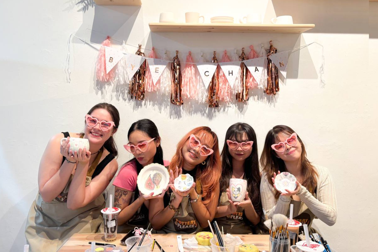Creative farewell party celebration with group pottery painting at PotteryPlease studio.